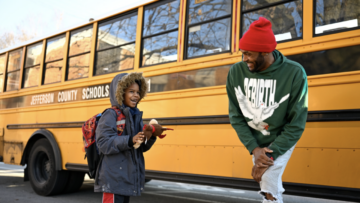 Student Levi and school bus driver Larry Farrish Jr.